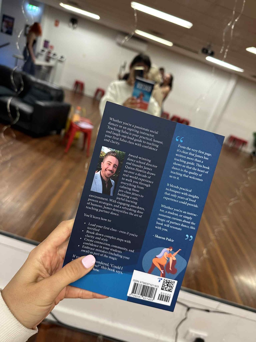 The back cover of Teaching Salsa, held up in the Dance Culture studio